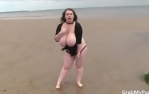 Milf with big boobs show off by beach