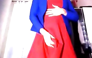 Young amateur cross dresser chaffing and touching in a red attire and blue blazer