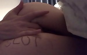Nasty slut plays and fingers pussy while spanking her ass