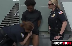 Black criminal is apprehended by two big titty MILFs.