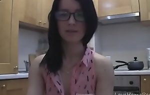 smashing teen with glasses chatting in the kitchen
